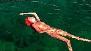 shaved naked girl flashing wet pussy by blue water?