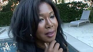 Ebony bikini babe flaunts huge natural tits nipples