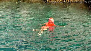 shaved naked girl flashing wet pussy by blue water?