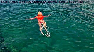 shaved naked girl flashing wet pussy by blue water?