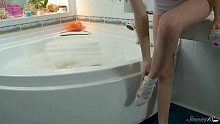 skinny blonde teen cums hard fingering shaved pussy under shower stream