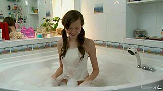 skinny blonde teen cums hard fingering shaved pussy under shower stream