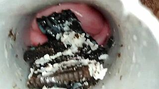 Pussy play involves spreading lips teasing clit with oreo cookie fetish