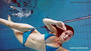 blue bikini clings to her tight pussy underwater teasing every curve