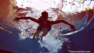 blue bikini clings to her tight pussy underwater teasing every curve