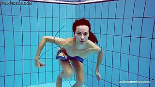 blue bikini clings to her tight pussy underwater teasing every curve