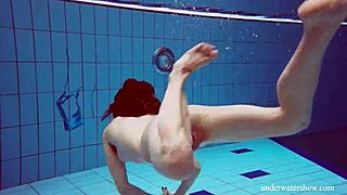 blue bikini clings to her tight pussy underwater teasing every curve