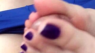 her purple toes wrap around cock for footjob