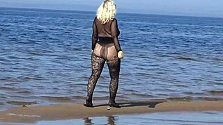 she struts black style on the beach flashing her big tits and ass for all