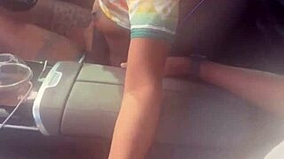 Playing with big black cock in the car outdoors