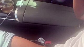 Playing with big black cock in the car outdoors