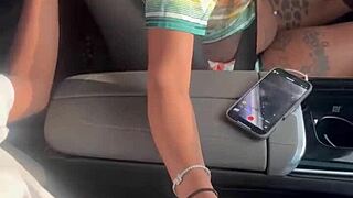 Playing with big black cock in the car outdoors