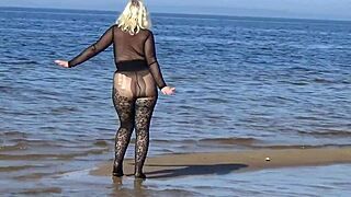she struts black style on the beach flashing her big tits and ass for all