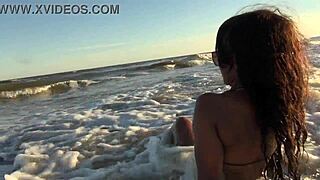 i strip bare on the sunny beach feeling the breeze on my skin.