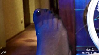 Sexy goddess teases feet in black pantyhose heels