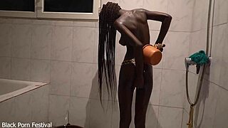 Sexy Dolcina showers her perfect skinny African body seductively.