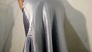 What if her satin dress clings wet while she rubs herself teasingly underneath?