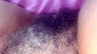 she spreads wide revealing her bushy hairy black ebony pretty pussy closeup
