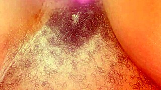she spreads wide revealing her bushy hairy black ebony pretty pussy closeup