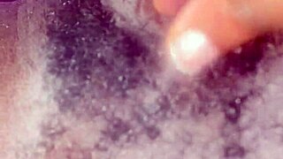 she spreads wide revealing her bushy hairy black ebony pretty pussy closeup