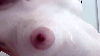 Oily Blonde Strips Teasing Boobs and Pussy Dripping Wet