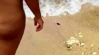 sexy asian wife bares her big natural tits nude on the beach