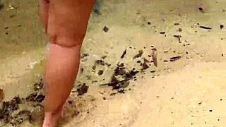 sexy asian wife bares her big natural tits nude on the beach