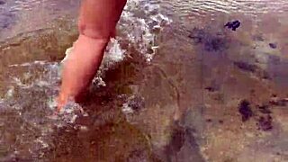 sexy asian wife bares her big natural tits nude on the beach