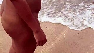 sexy asian wife bares her big natural tits nude on the beach