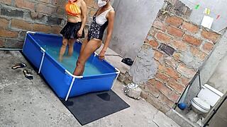 Athletic Indian and curvy Latina bask sensually poolside