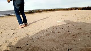 Busty Brunette Takes Cock on Beach