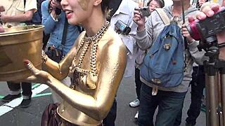 gold powder show slips revealing nipples during costume performance