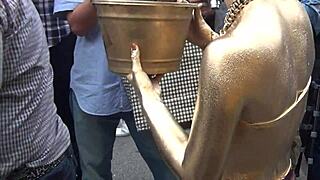 gold powder show slips revealing nipples during costume performance