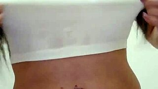 Wet t-shirt clinging to Emy Angel's curves