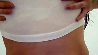 Wet t-shirt clinging to Emy Angel's curves