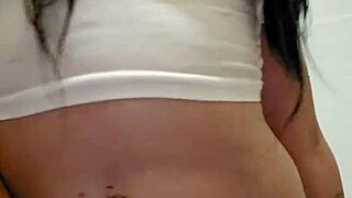 Wet t-shirt clinging to Emy Angel's curves