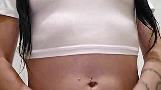 Wet t-shirt clinging to Emy Angel's curves