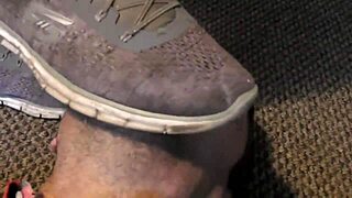 Worship clunky filthy sneakers under femdom trampling