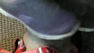 Worship clunky filthy sneakers under femdom trampling