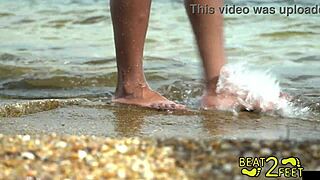Giggles' feet covered in sand at beach