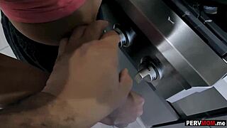 Stepmom deepthroats hard cock while cooking breakfast in kitchen