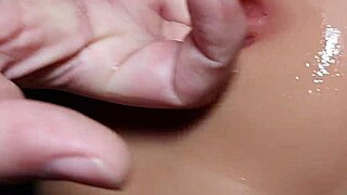 Peeking inside her smooth shaved pussy close up