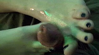 Amateur milf gives her first ever oiled footjob at home