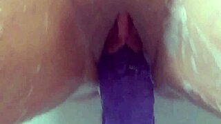 Masturbating in the bath with my big purple dildo until i cum