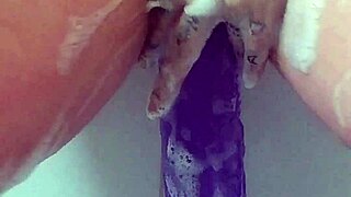 Masturbating in the bath with my big purple dildo until i cum