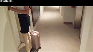 Milf in stockings and heels walks through hotel corridors