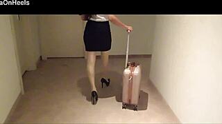 Milf in stockings and heels walks through hotel corridors