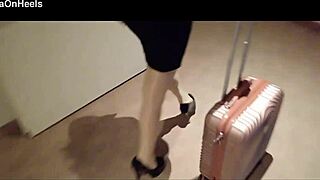 Milf in stockings and heels walks through hotel corridors