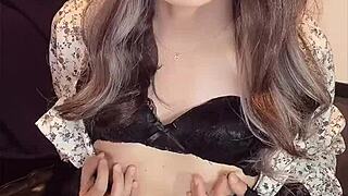 crossdressing japanese ladyboy quietly masturbates in one piece outfit