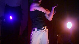 muscular men stroke big cocks in purple and orange shadows